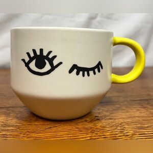 Starbucks 2011 Winking Eye Mug with yellow silicone handle